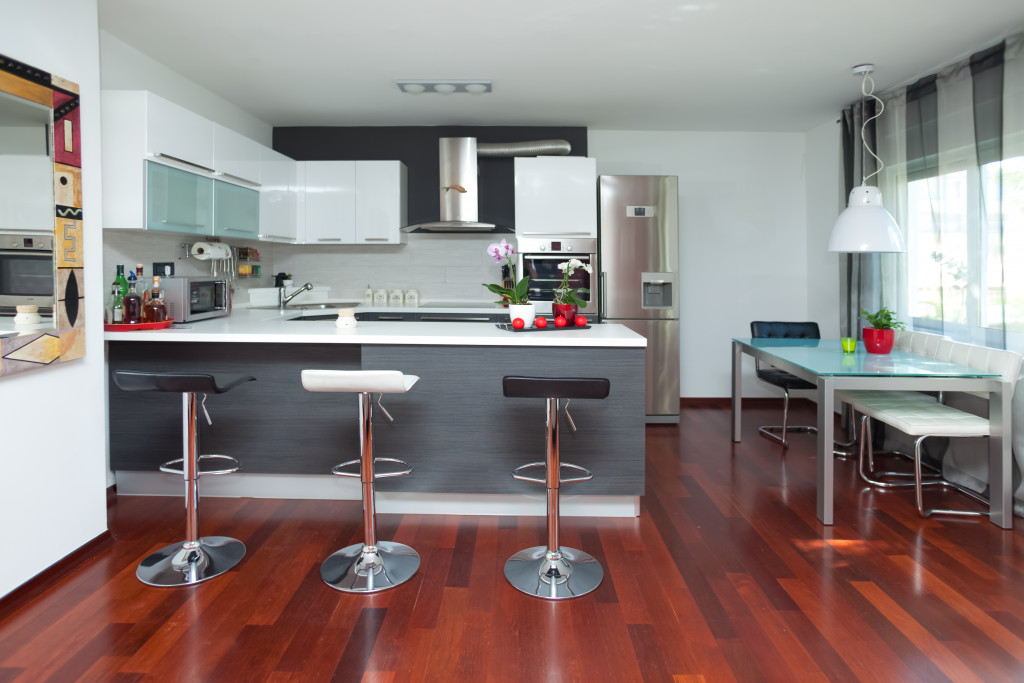 A modern kitchen and dining area in an open house