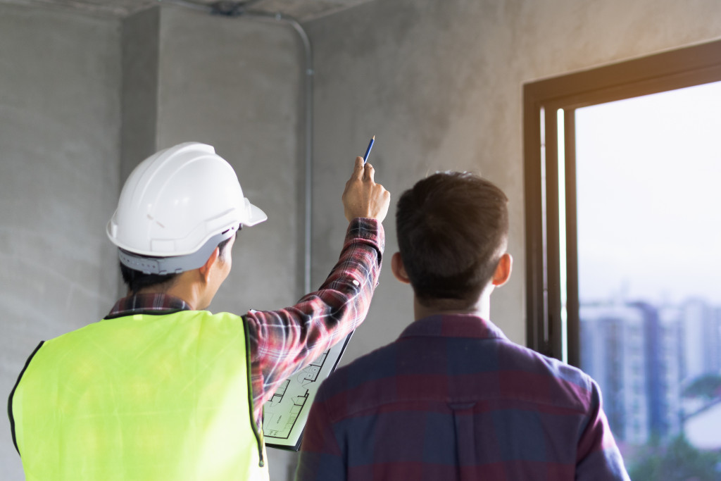 A home inspector inspecting structural integrity