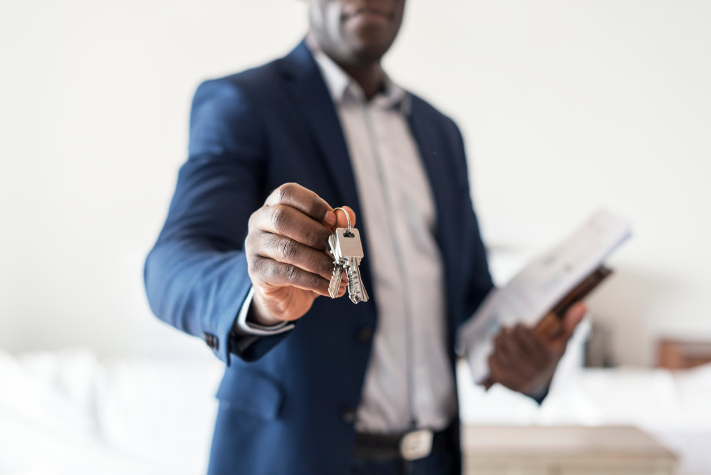 real estate agent holding house keys