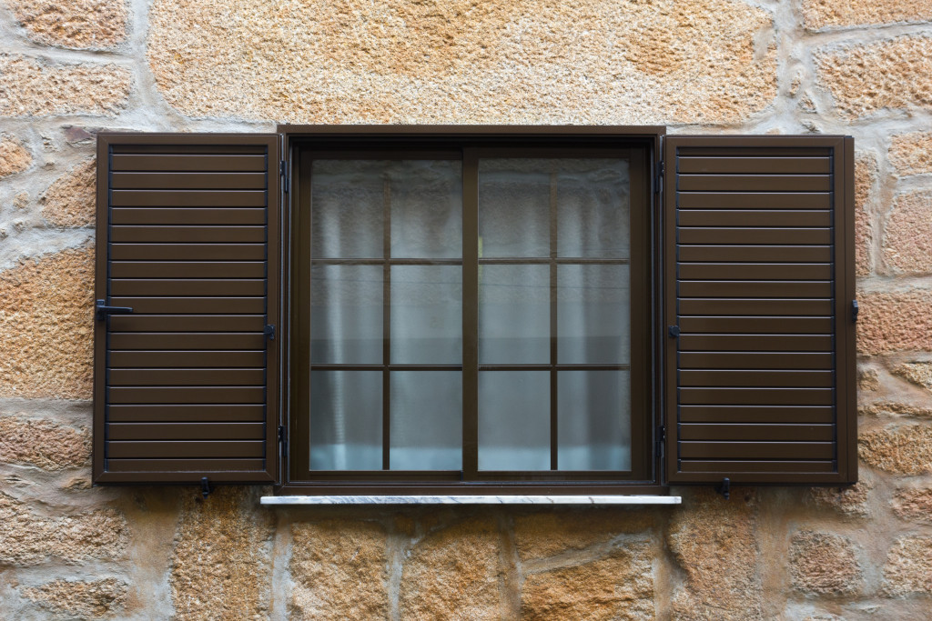 A window with brown shutters