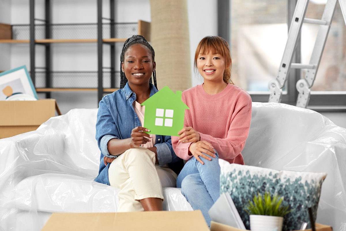 happy smiling women holding green house