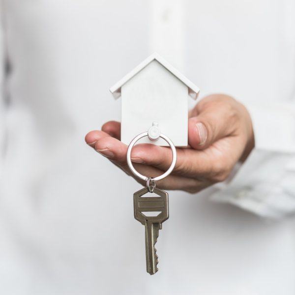 holding a house key
