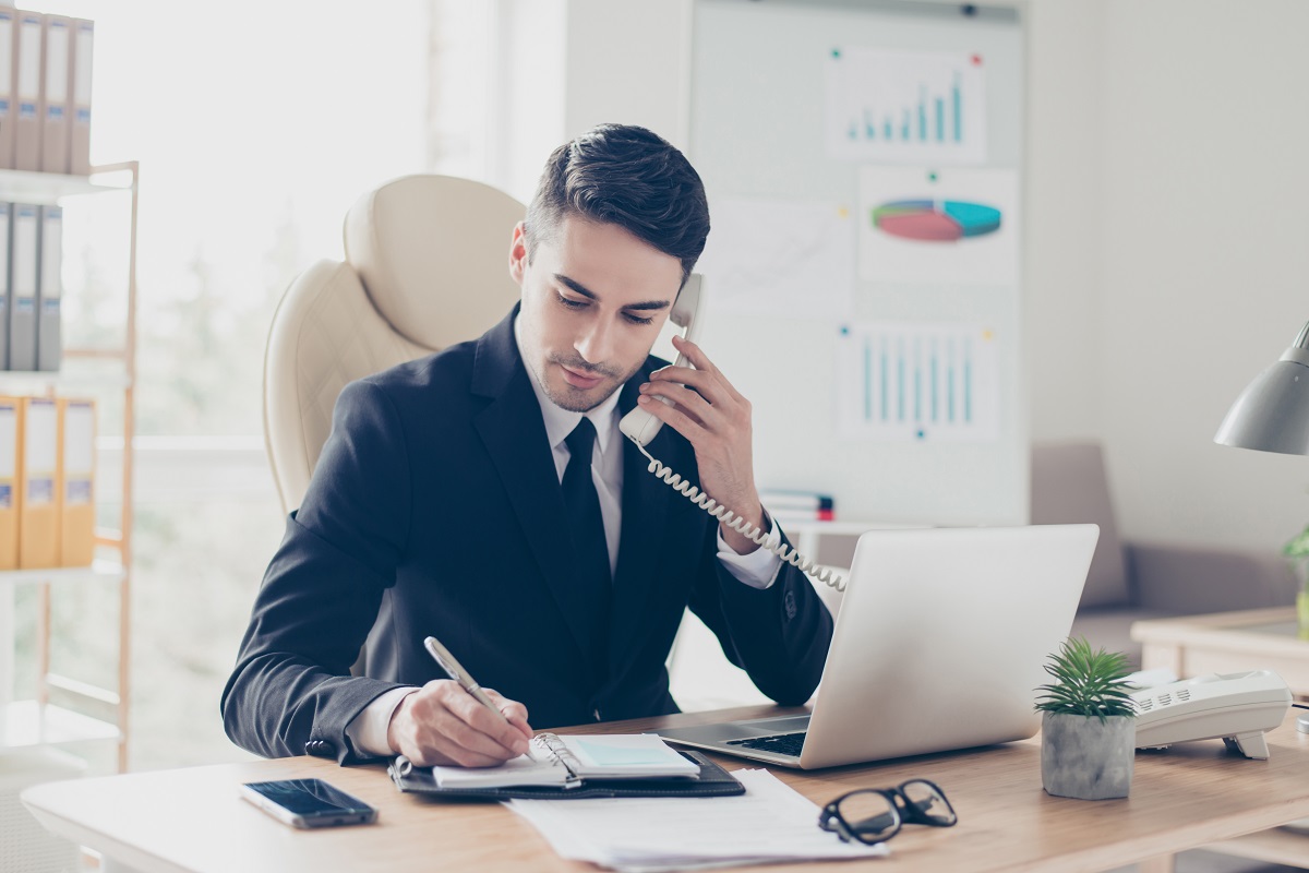 man in the office answering a call