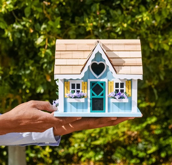 Man holding colorful house model
